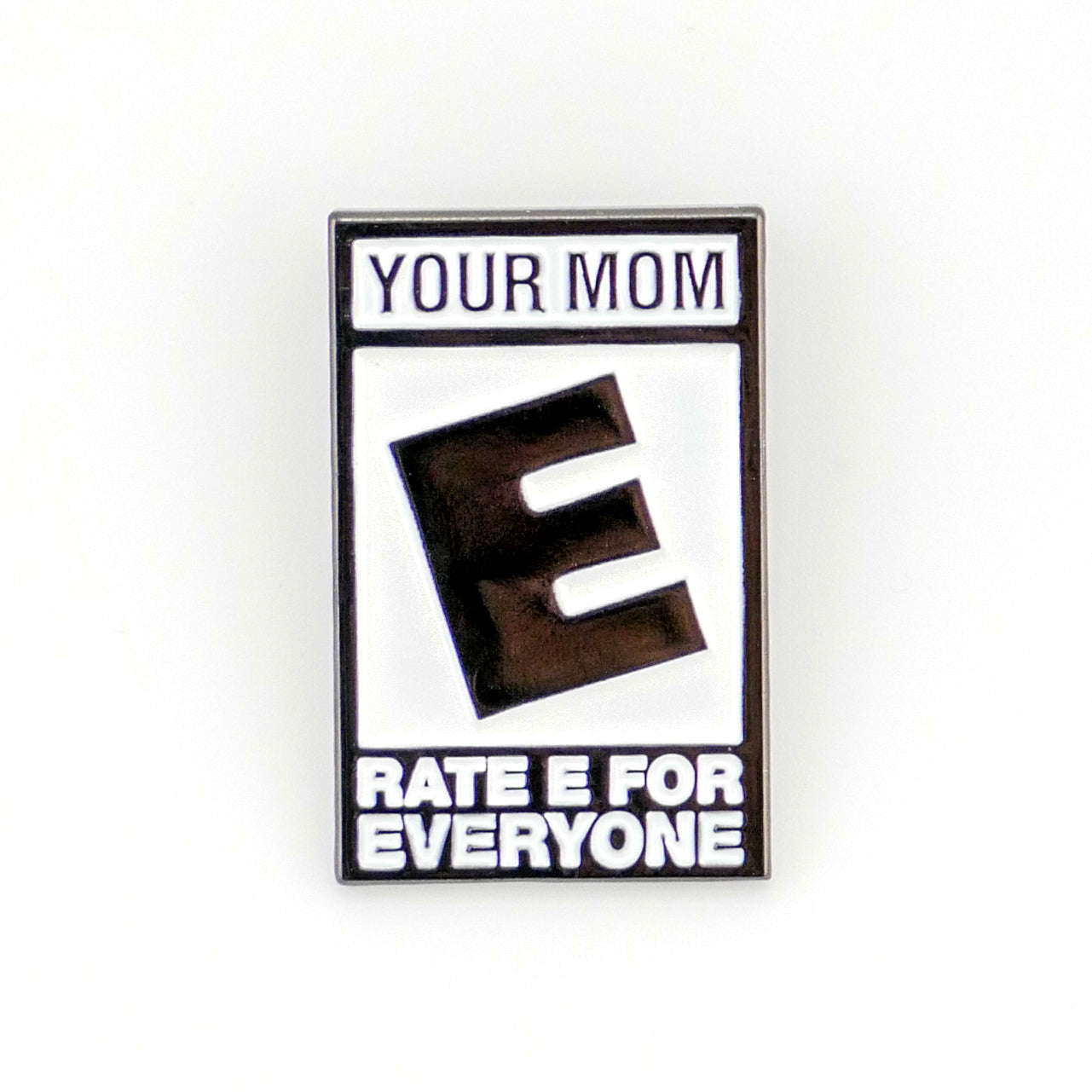 The Your Mom “Rated E” pin by Ballmarkers from Logie Joes features a large black E, “YOUR MOM” above, and “RATE E FOR EVERYONE” below—mimicking a game rating for a funny golf accessory.