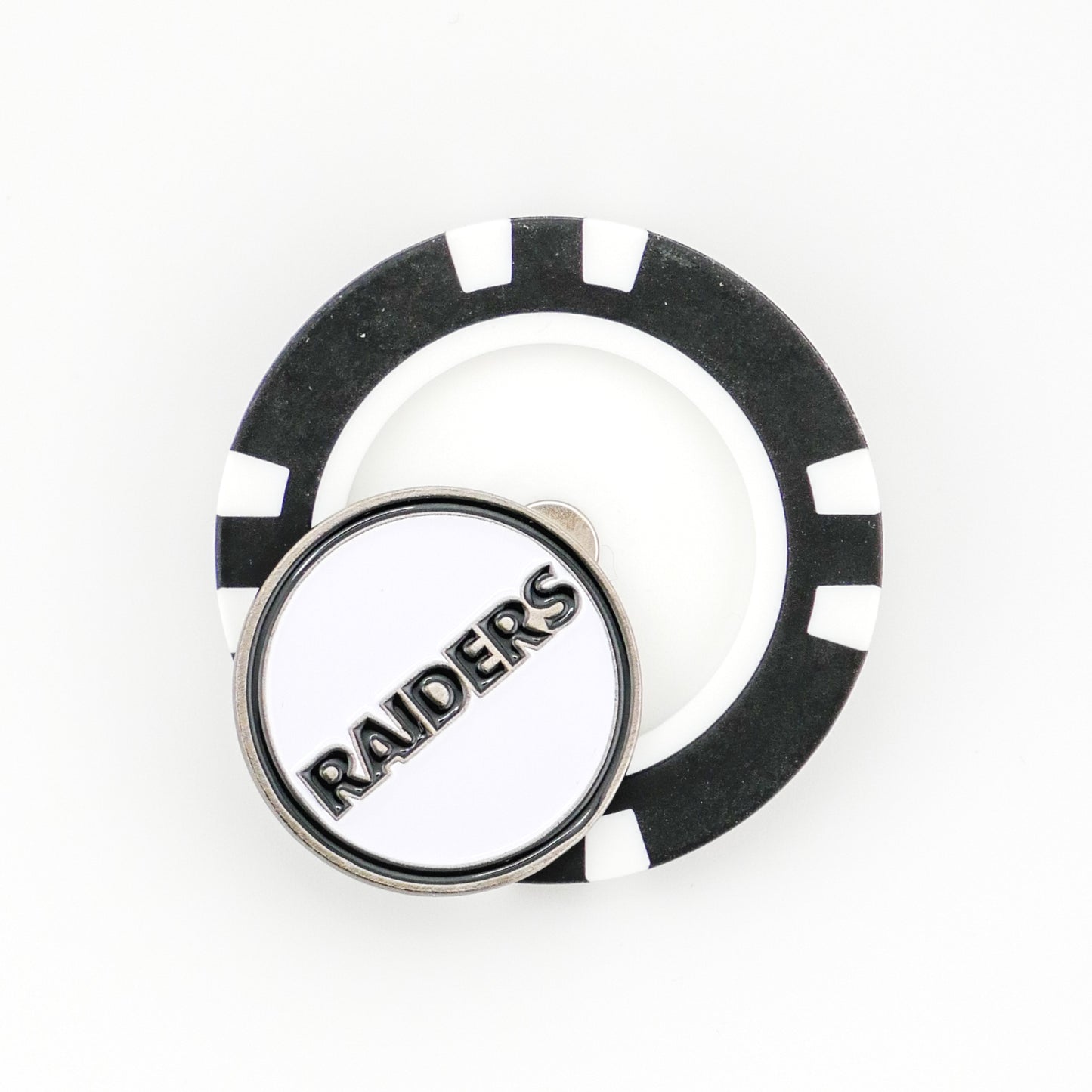 The Ballmarkers by Logie Joes Las Vegas Raiders golf ball marker is a black and white poker chip style with a round pin featuring RAIDERS in bold metallic letters on a white background.