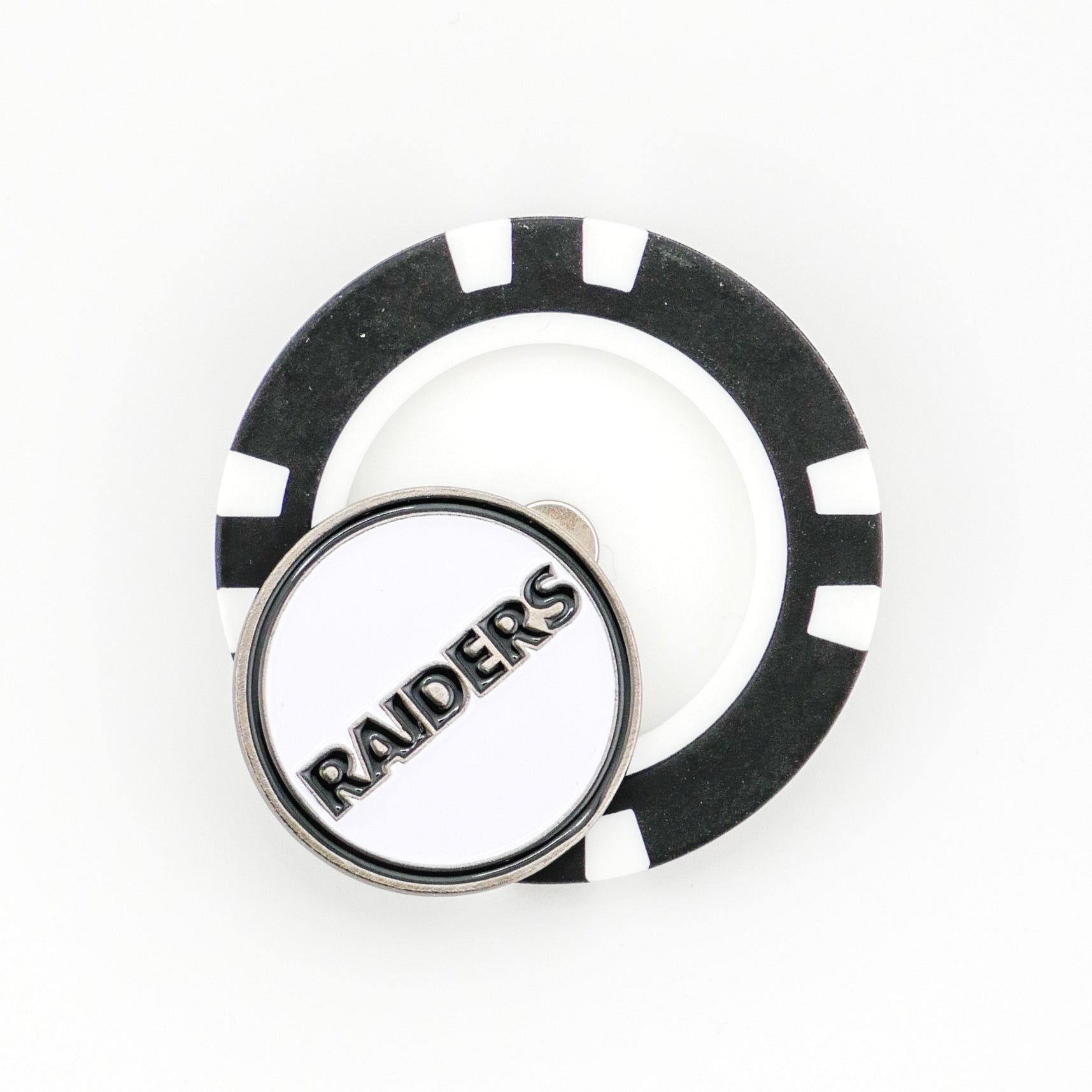 The Ballmarkers by Logie Joes Las Vegas Raiders golf ball marker is a black and white poker chip style with a round pin featuring RAIDERS in bold metallic letters on a white background.